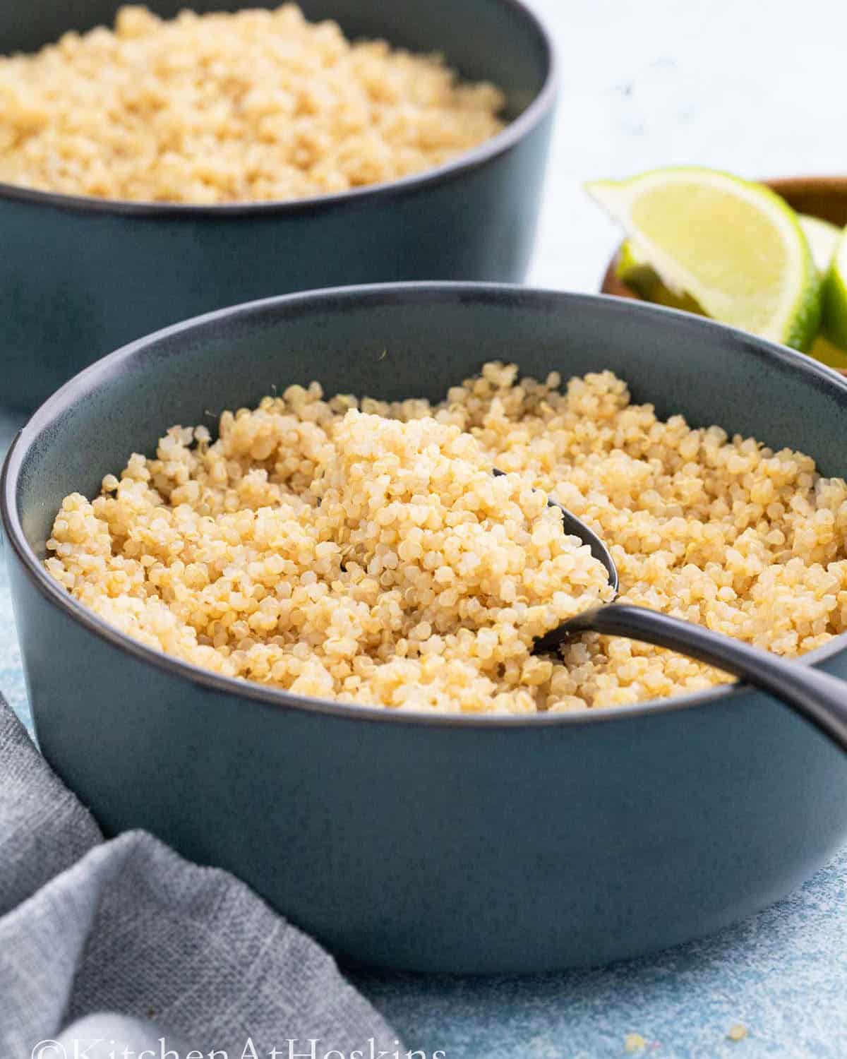 yellow quinoa in a blue bowl.