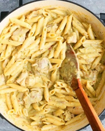 white yellow pasta in a white pan.