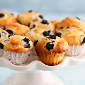 mini blueberry muffins in a white cake stand.