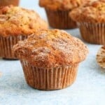 apple muffins placed on a blue board.