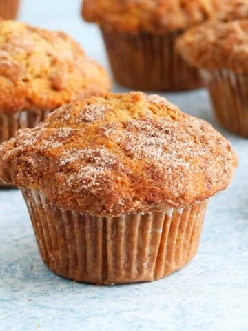 apple muffins placed on a blue board.