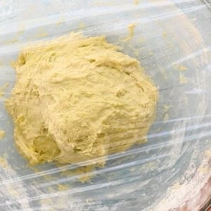bread dough in a glass bowl.