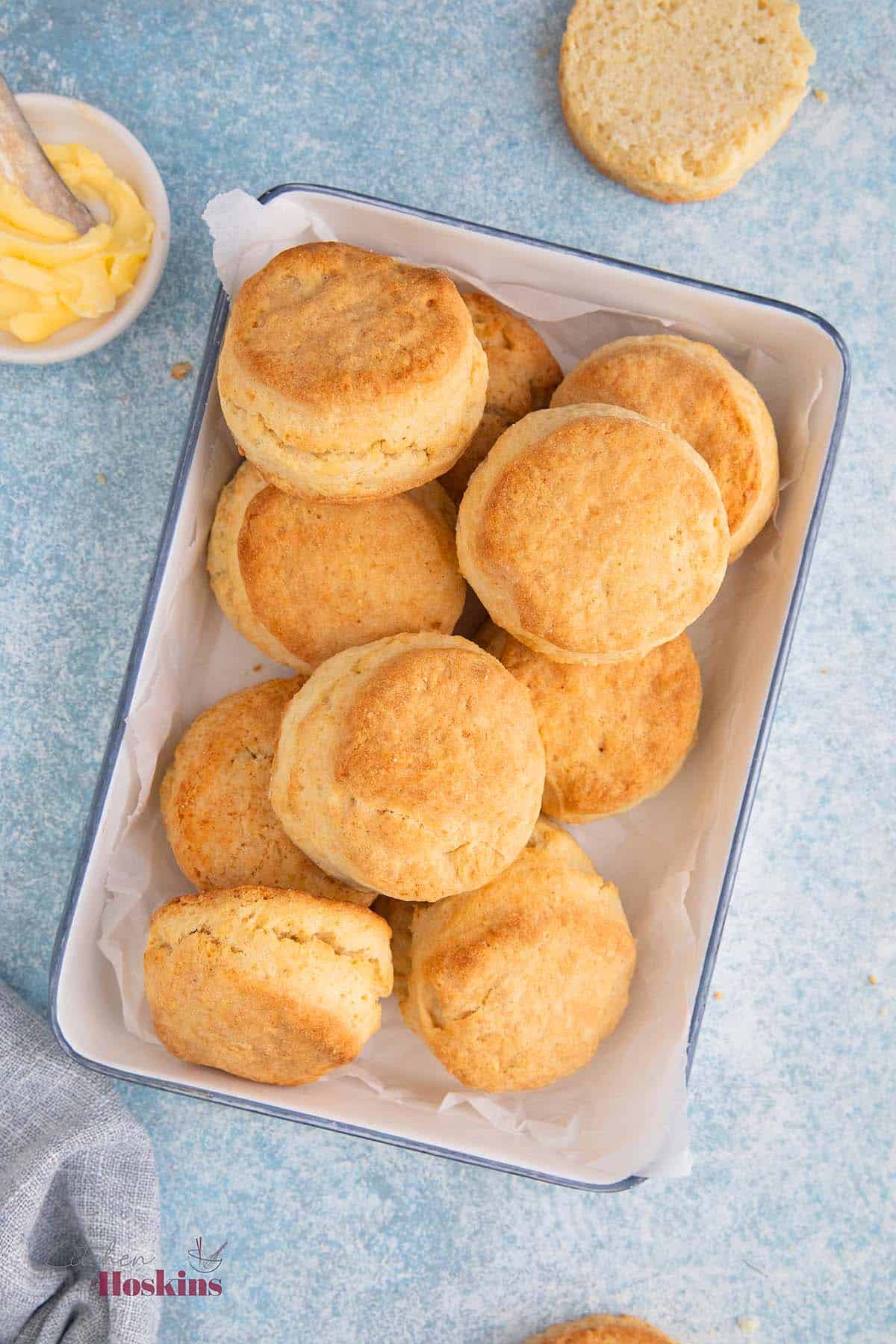 a white metal try with baked biscuits.