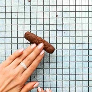 brown cookie dough on a metal wire rack.
