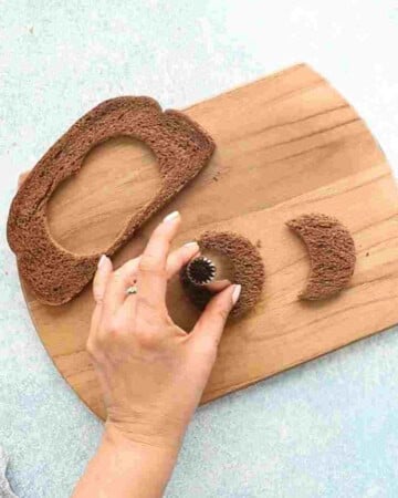 one brown bread cut outs on a wooden board.