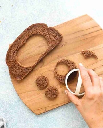 one brown bread cut outs on a wooden board.