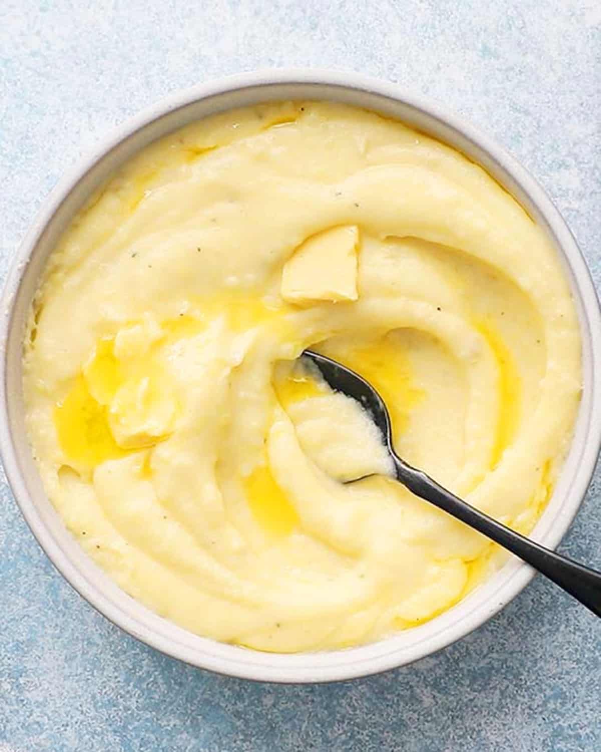 yukon gold mashed potatoes in a white bowl.