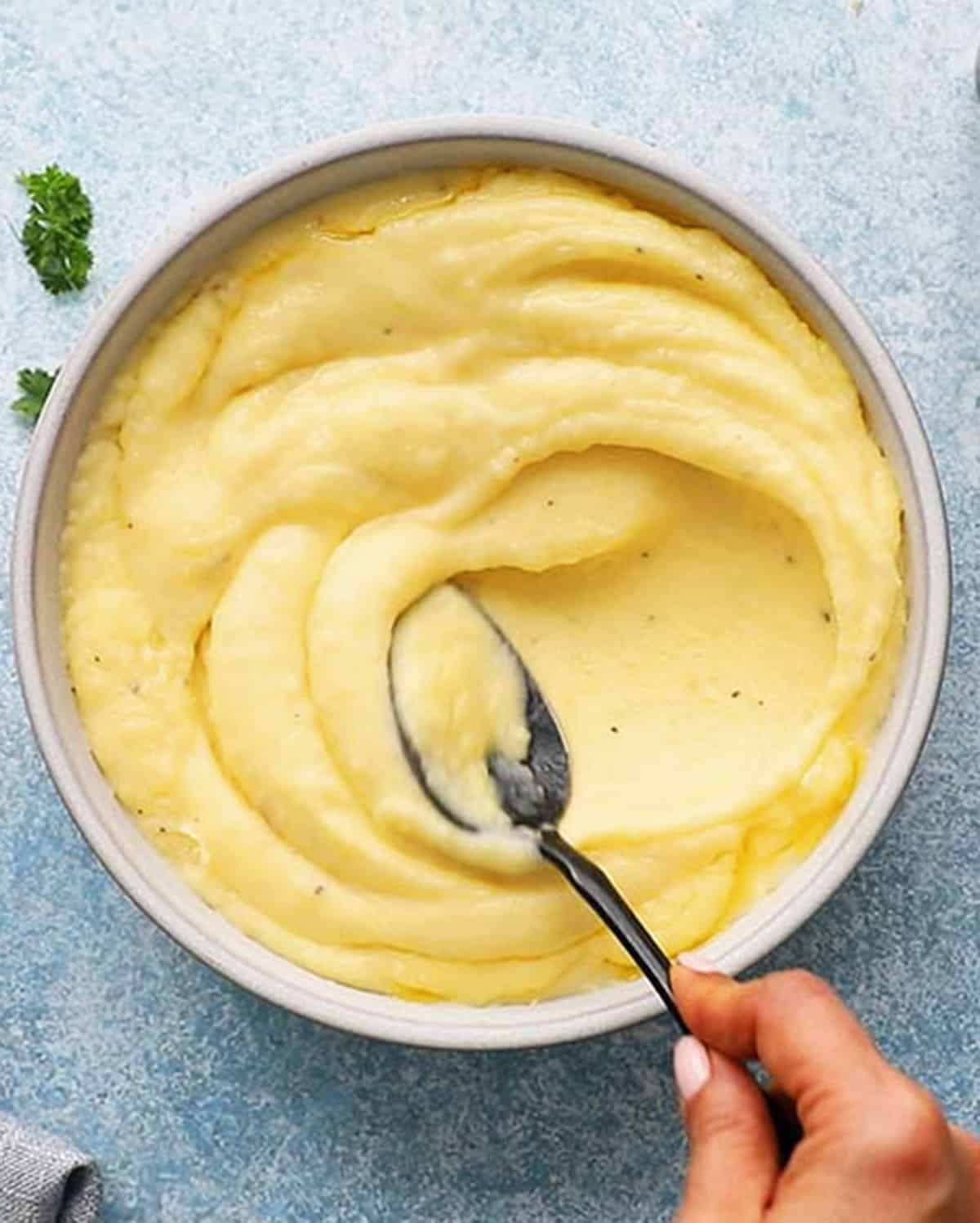 yukon gold mashed potatoes in a white bowl.