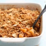 gluten free apple crumble in a white baking dish.