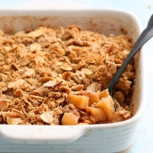 gluten free apple crumble in a white baking dish.