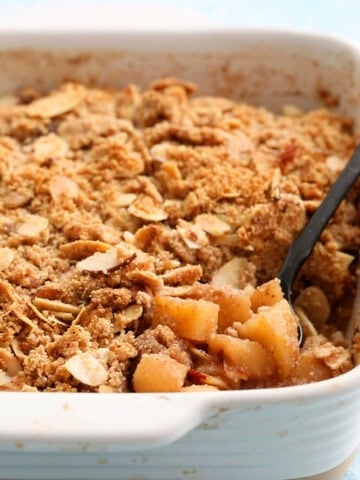 gluten free apple crumble in a white baking dish.
