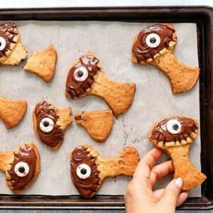 Halloween tree cookies on a parchment lined baking sheet.