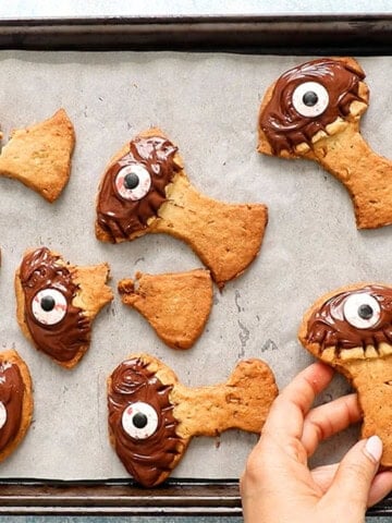 Halloween tree cookies on a parchment lined baking sheet.