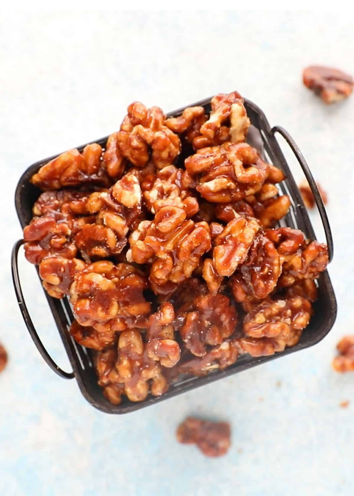 candied walnuts in a iron basket.
