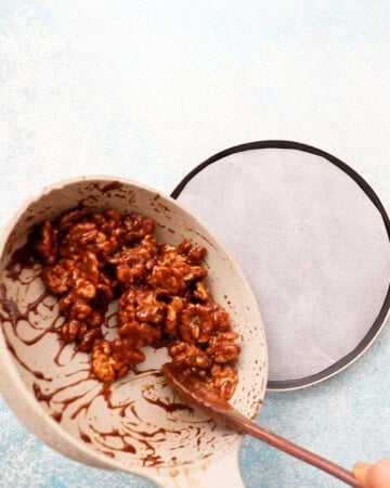 candied walnuts cooking in a skillet.