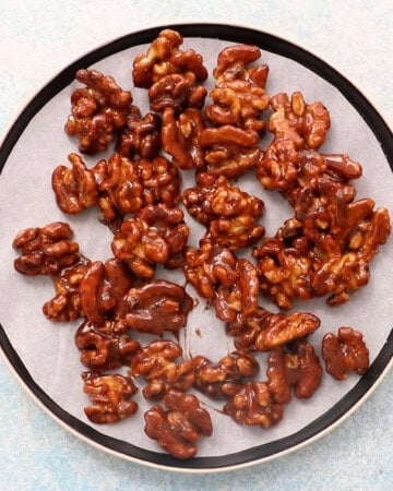 candied walnuts cooking in a plate.