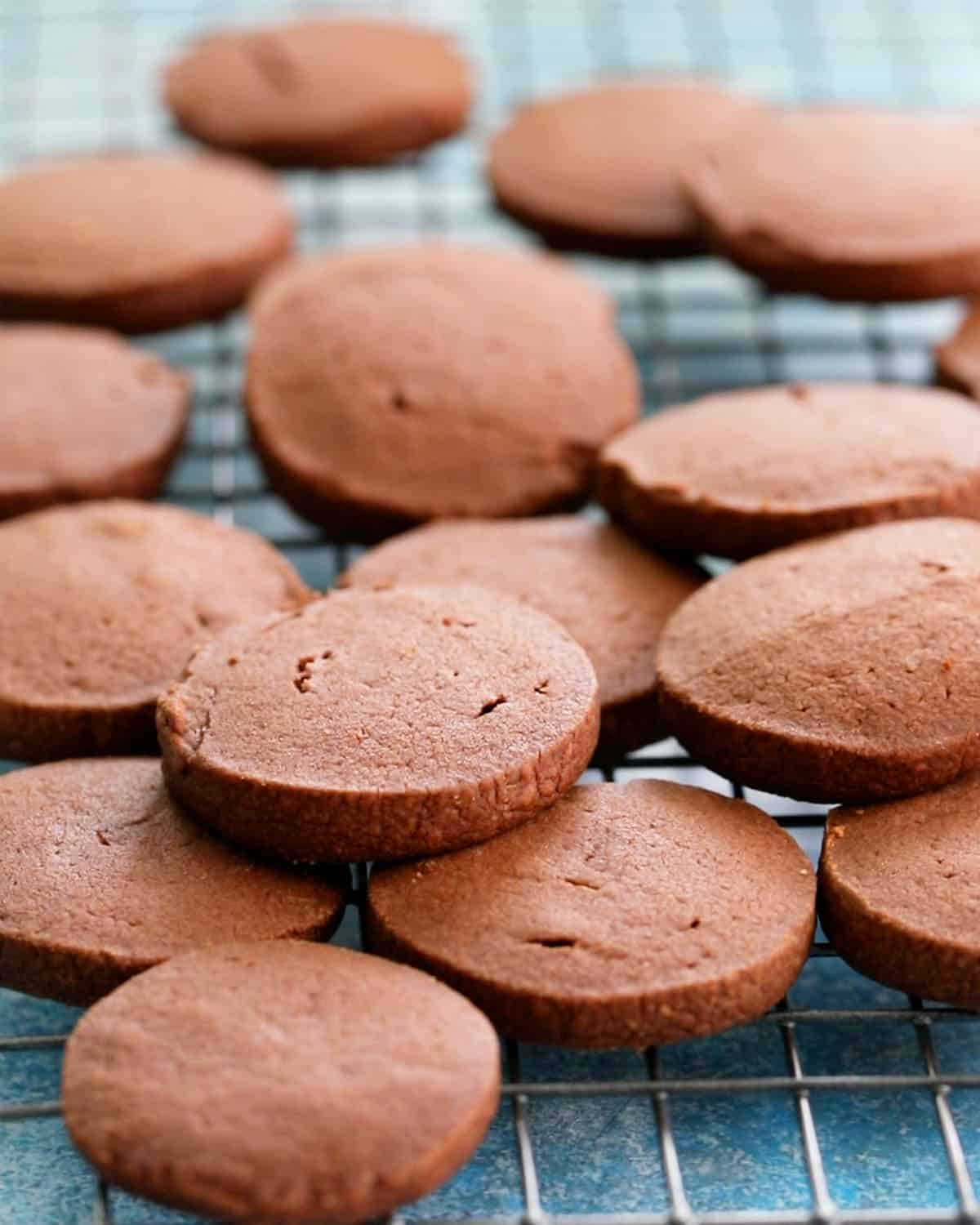 chocolate shortbread cookies on a wire rack.