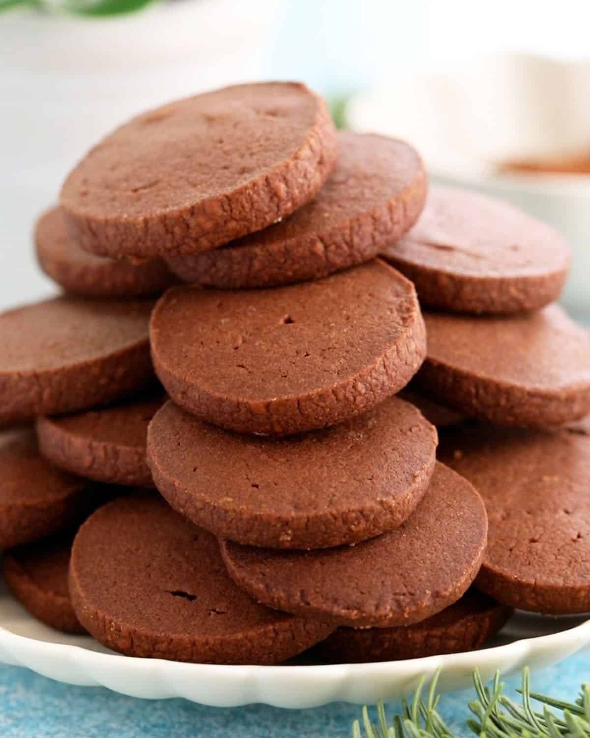 chocolate shortbread cookies on a white plate.