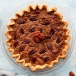 one pecan pie without corn syrup in a glass pie dish.