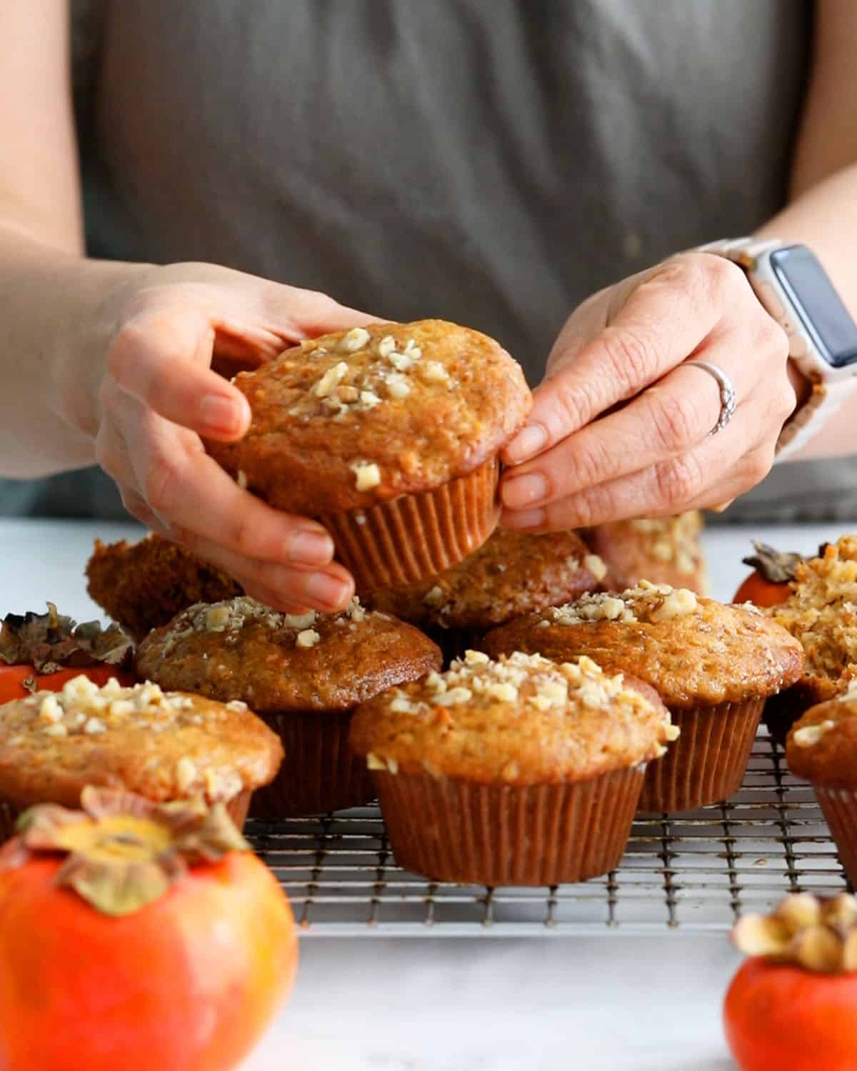 persimmon muffins on a wire rack.