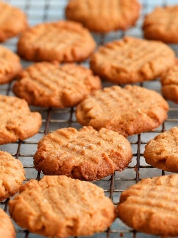 almond butter cookies on a wire rack.