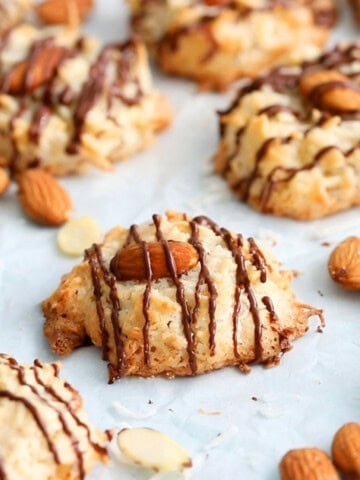 almond joy cookies on a white tray.
