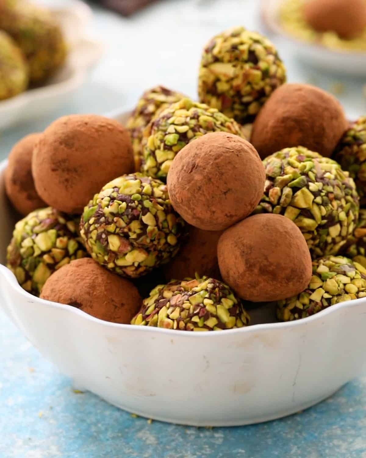 chocolate avocado truffles in a white bowl.