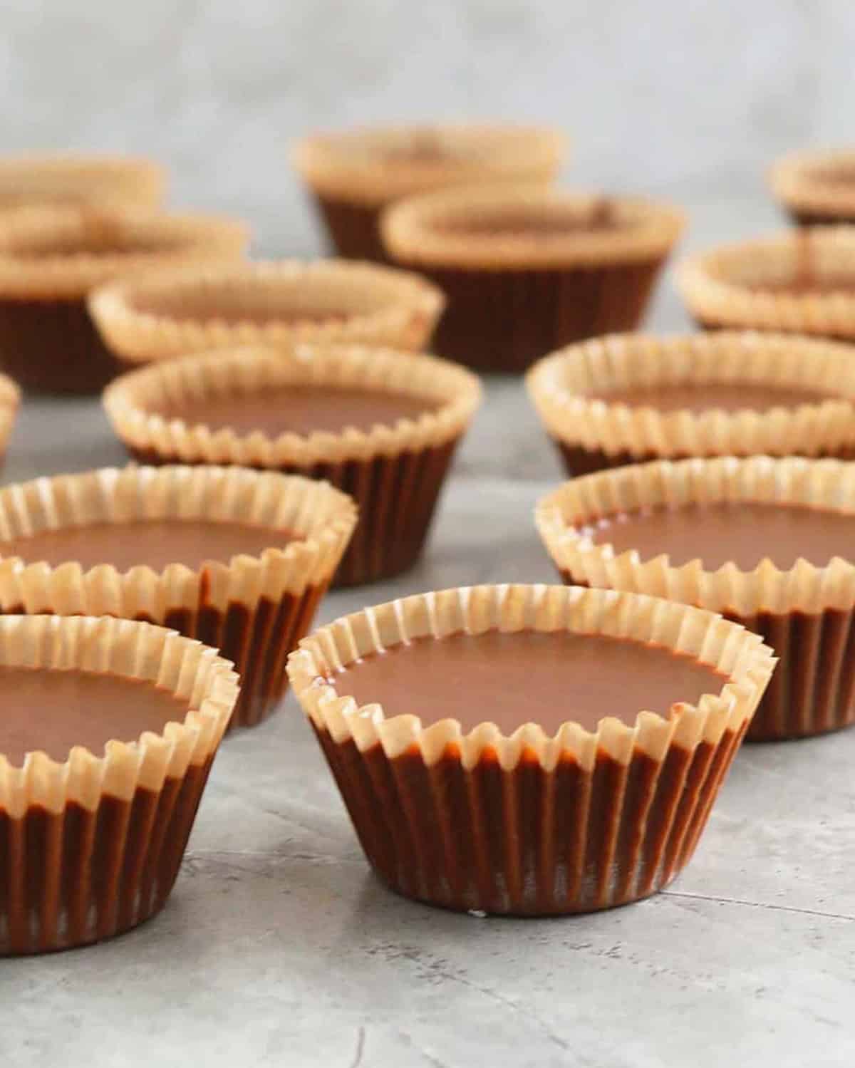 brown almond butter cups in a white board.