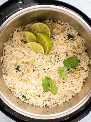 white and green cilantro lime rice in an instant pot.
