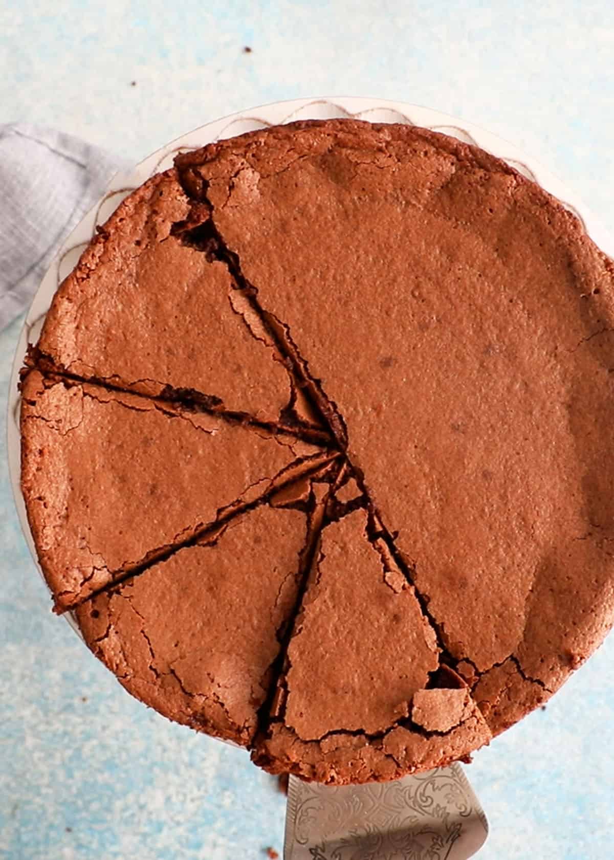 one round almond flour chocolate cake in a cake platter.