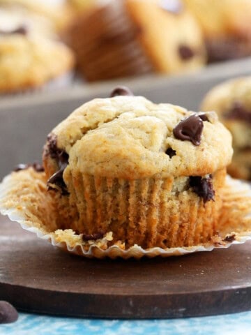 one banana chocolate chip muffin in a brown board.