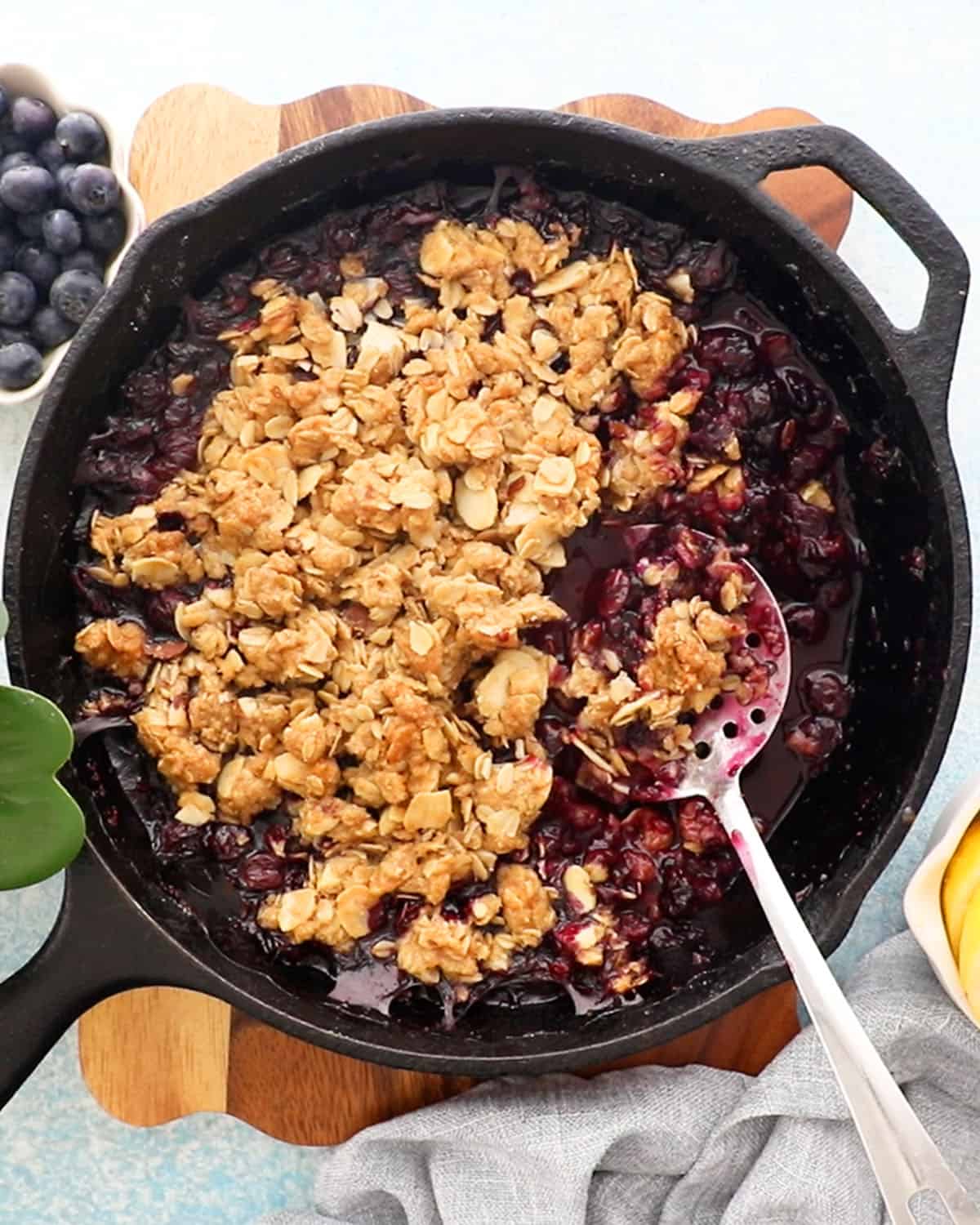 blueberry crisp in a black skillet.