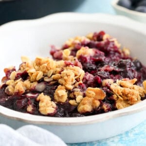 blueberry crisp in a white bowl.