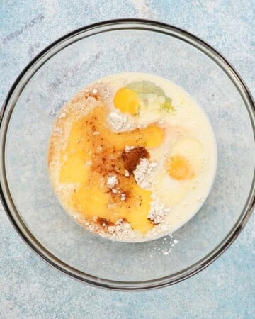 milk and eggs in a large glass bowl. 