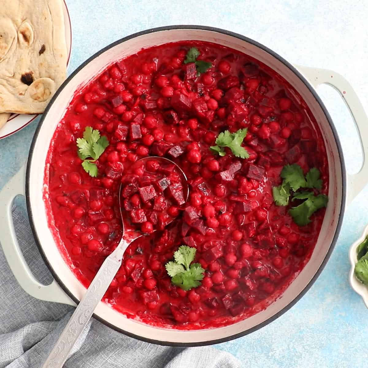 pink beet curry in a white pot.