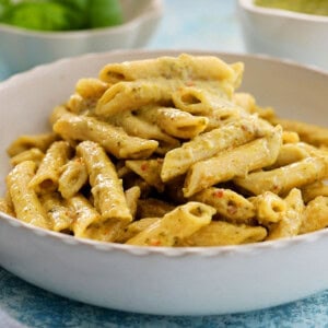 pesto pasta in a white dish.