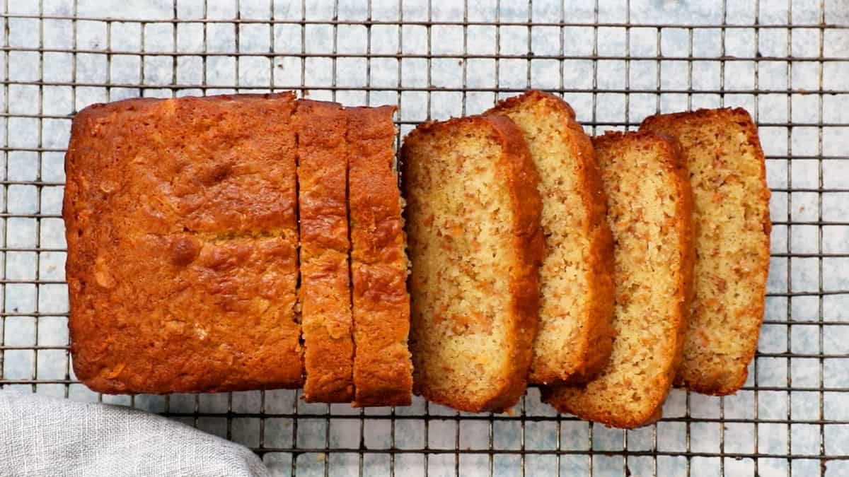 sliced persimmon bread placed on a wire rack.
