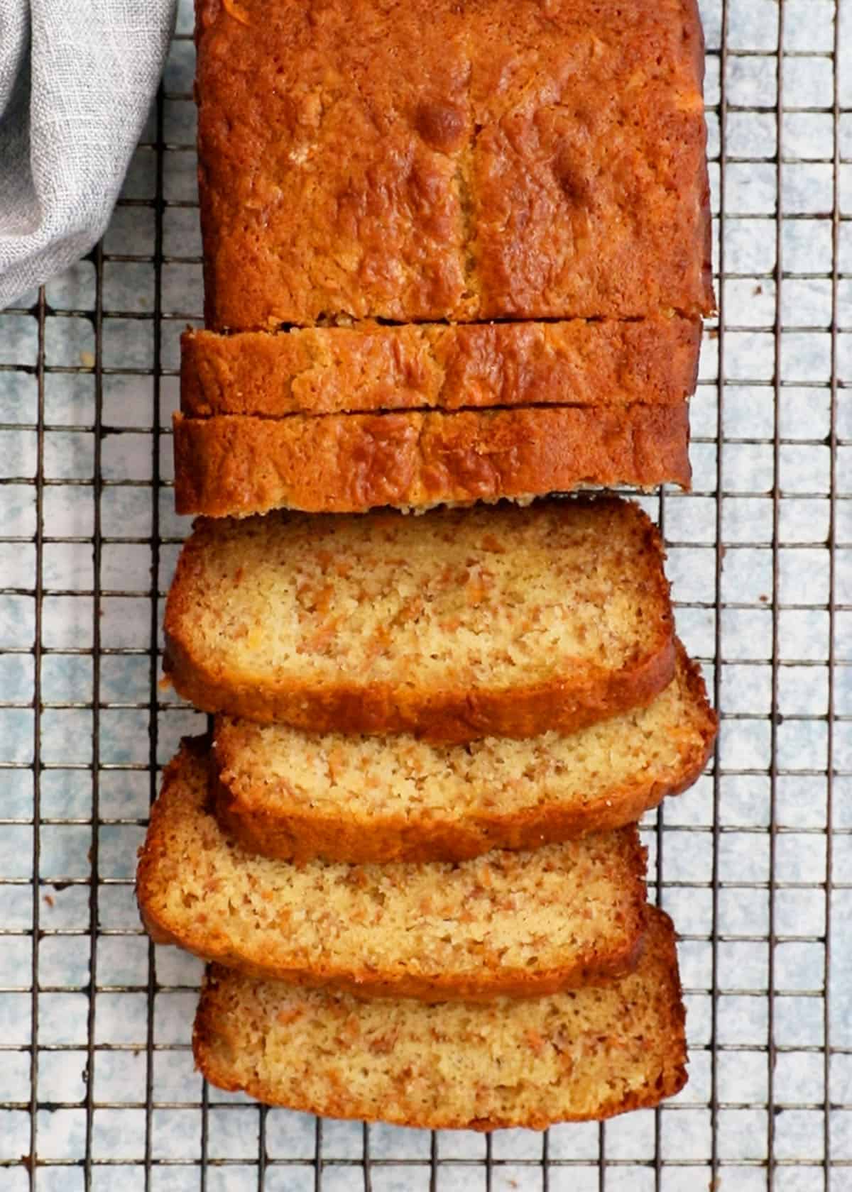 sliced persimmon bread placed on a wire rack.