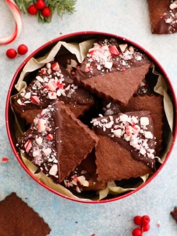 brown chocolate sugar cookies in a red cookie tin.