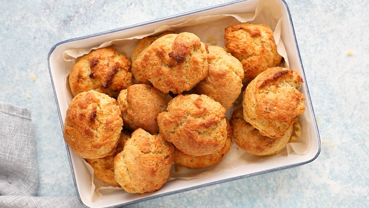 baked drop biscuits in a white rectangular tray.