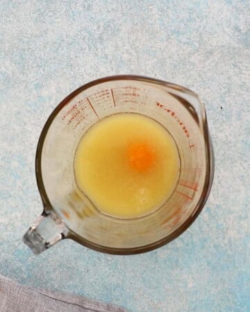 yellow liquid in a glass measuring cup. 