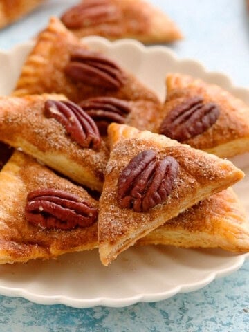 pie crust cookies in a white plate.