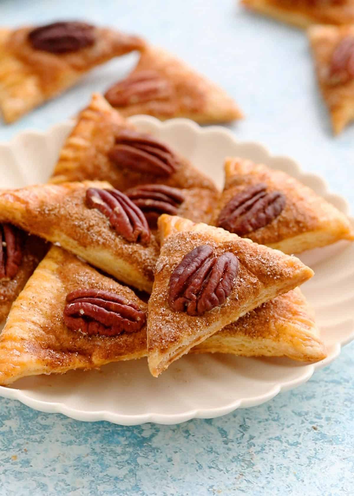pie crust cookies in a white plate.