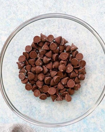 brown chocolate chips in a glass bowl.
