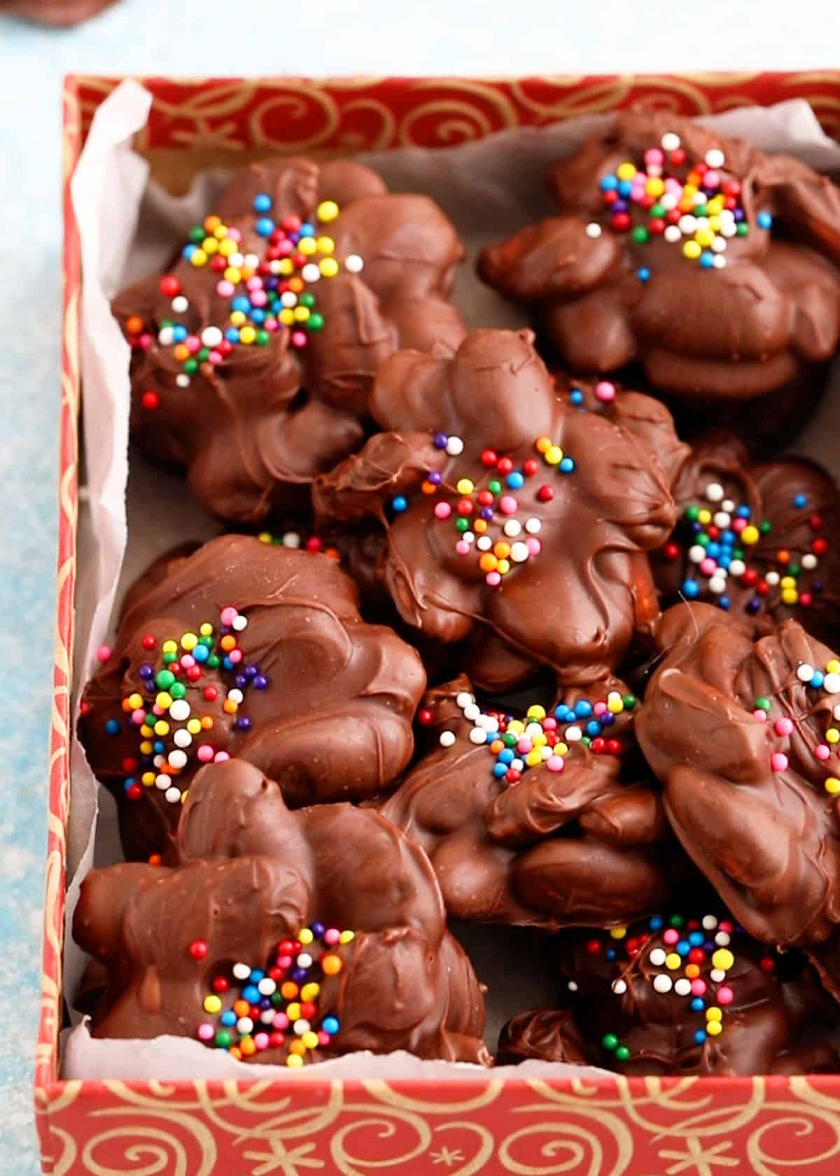 chocolate almond clusters in a red box.