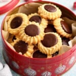 flower shaped butter cookies in a red cookie tin.