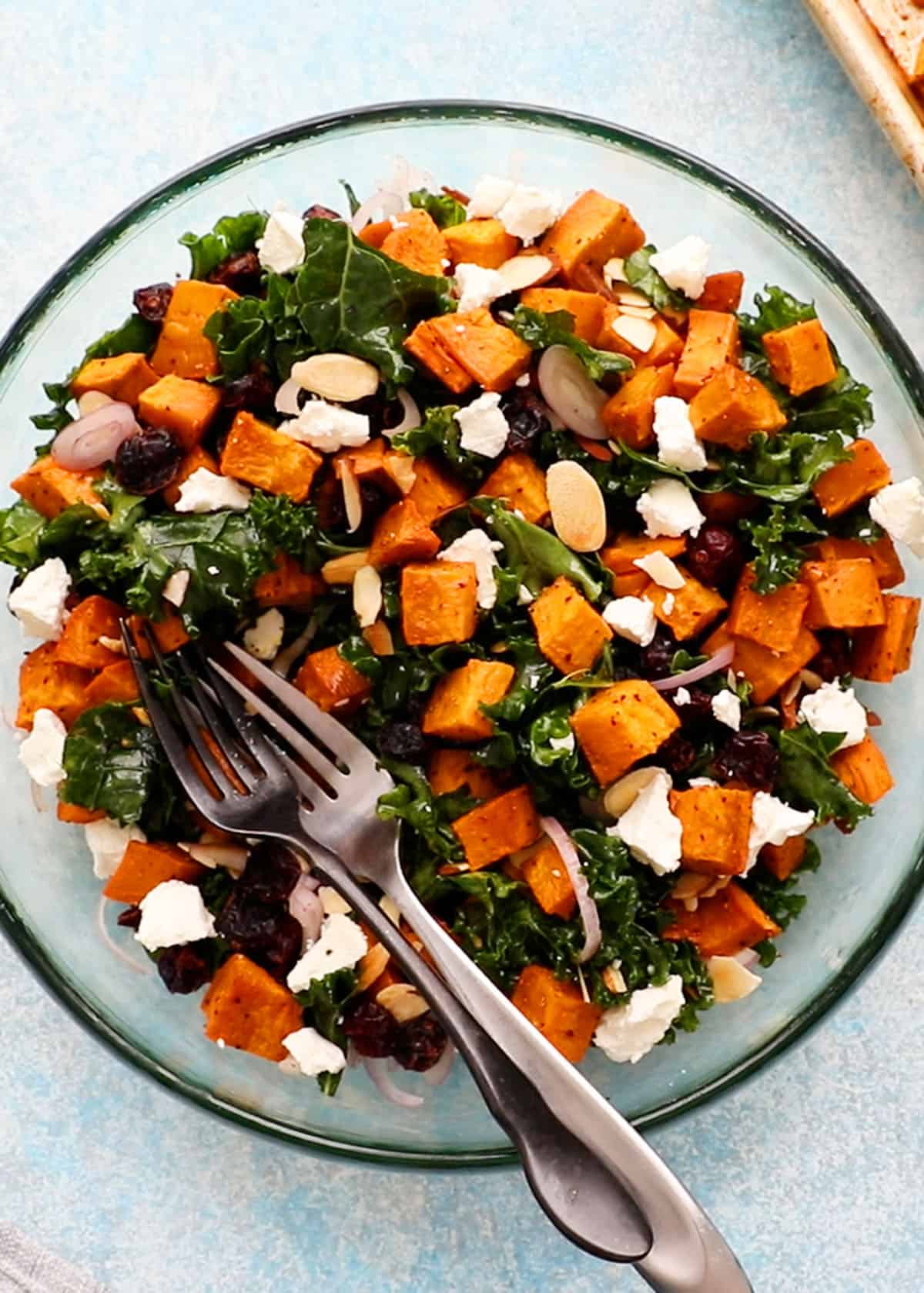 sweet potato and kale salad in a large glass bowl.