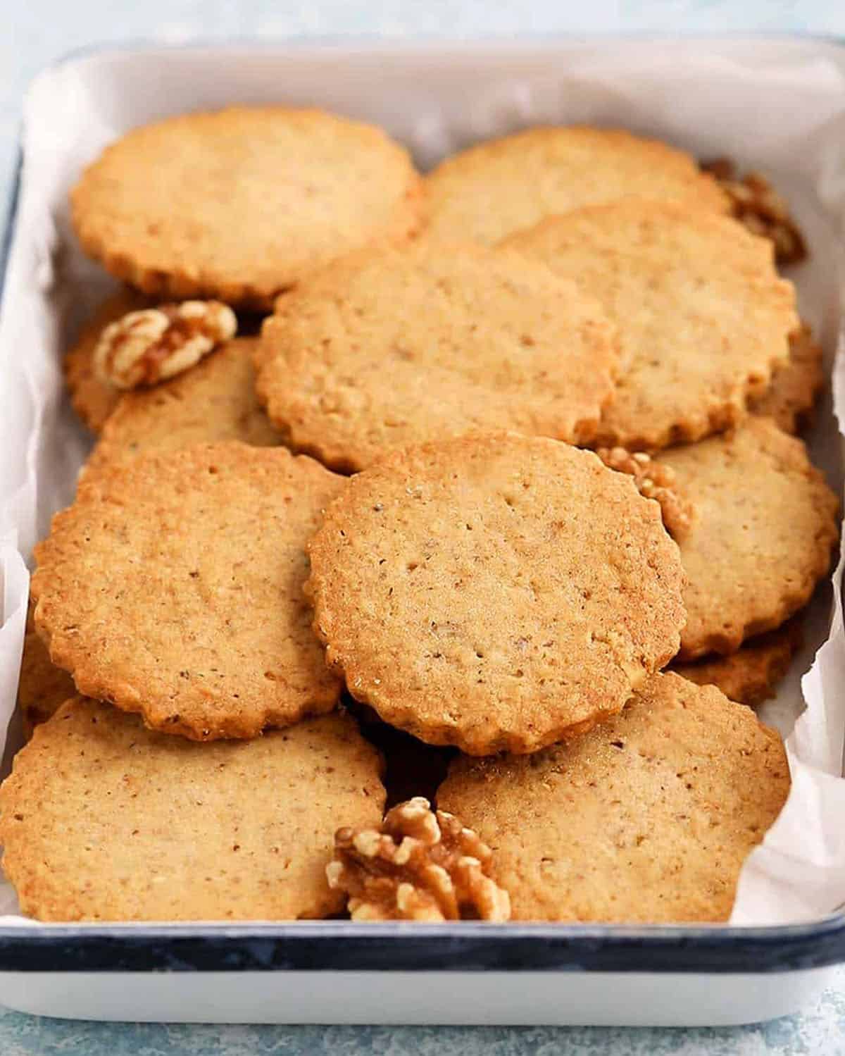walnut cookies in a white tray.