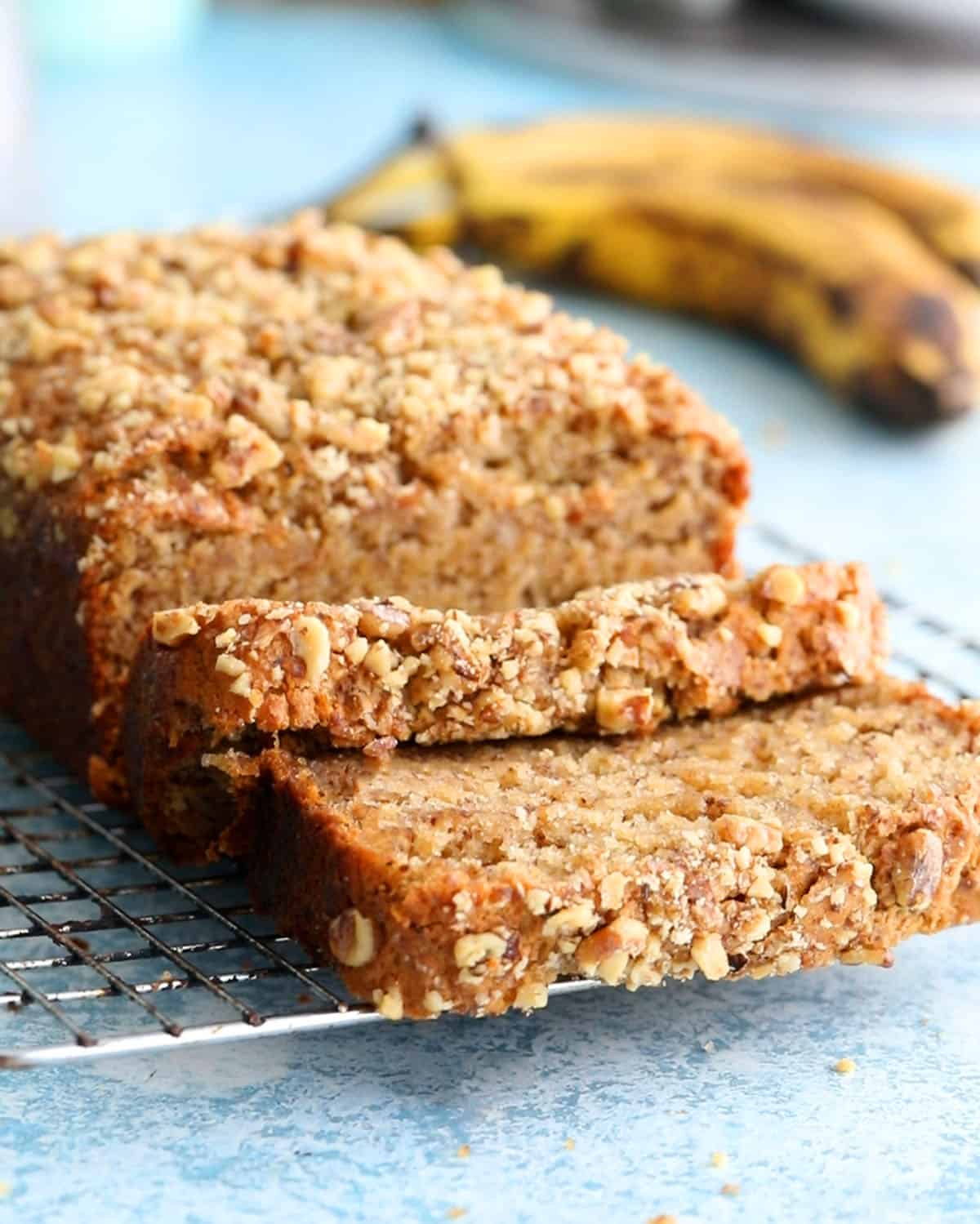 one eggless banana bread loaf on a wire rack.