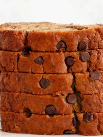 5 slices of banana chocolate chip bread stacked on top of each other.